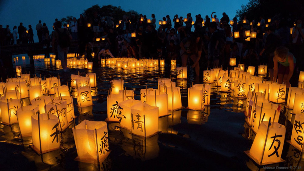 Lanterns on Green Lake at dusk.